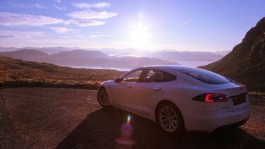 Whitecar Tesla at Applecross Pass on the North Coast 500