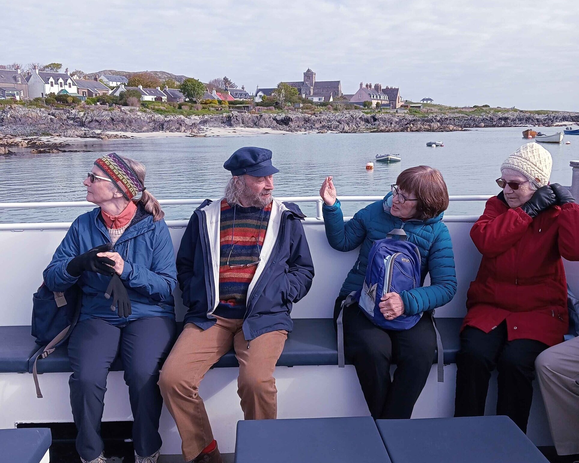 A McKinlay Kidd tour group travelling on a ferry to the Isle of Iona