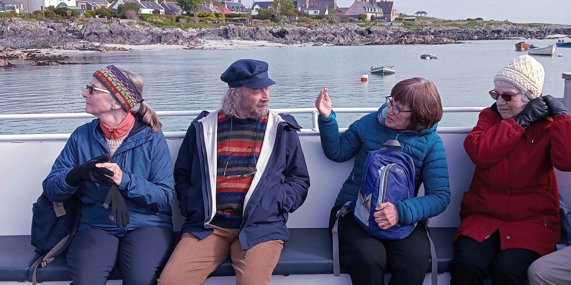 A McKinlay Kidd tour group travelling on a ferry to the Isle of Iona