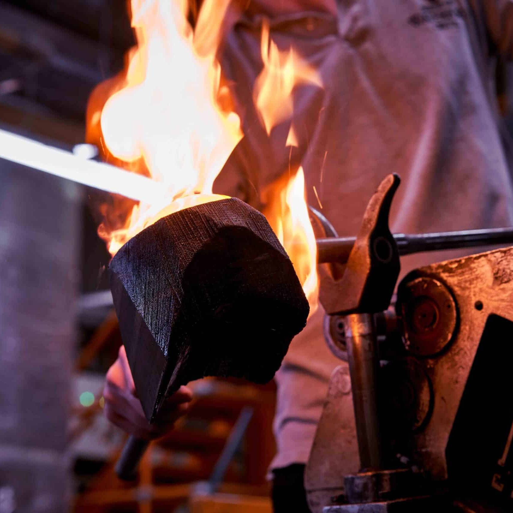 A professional blowing crystal glass at the Waterford Crystal factory