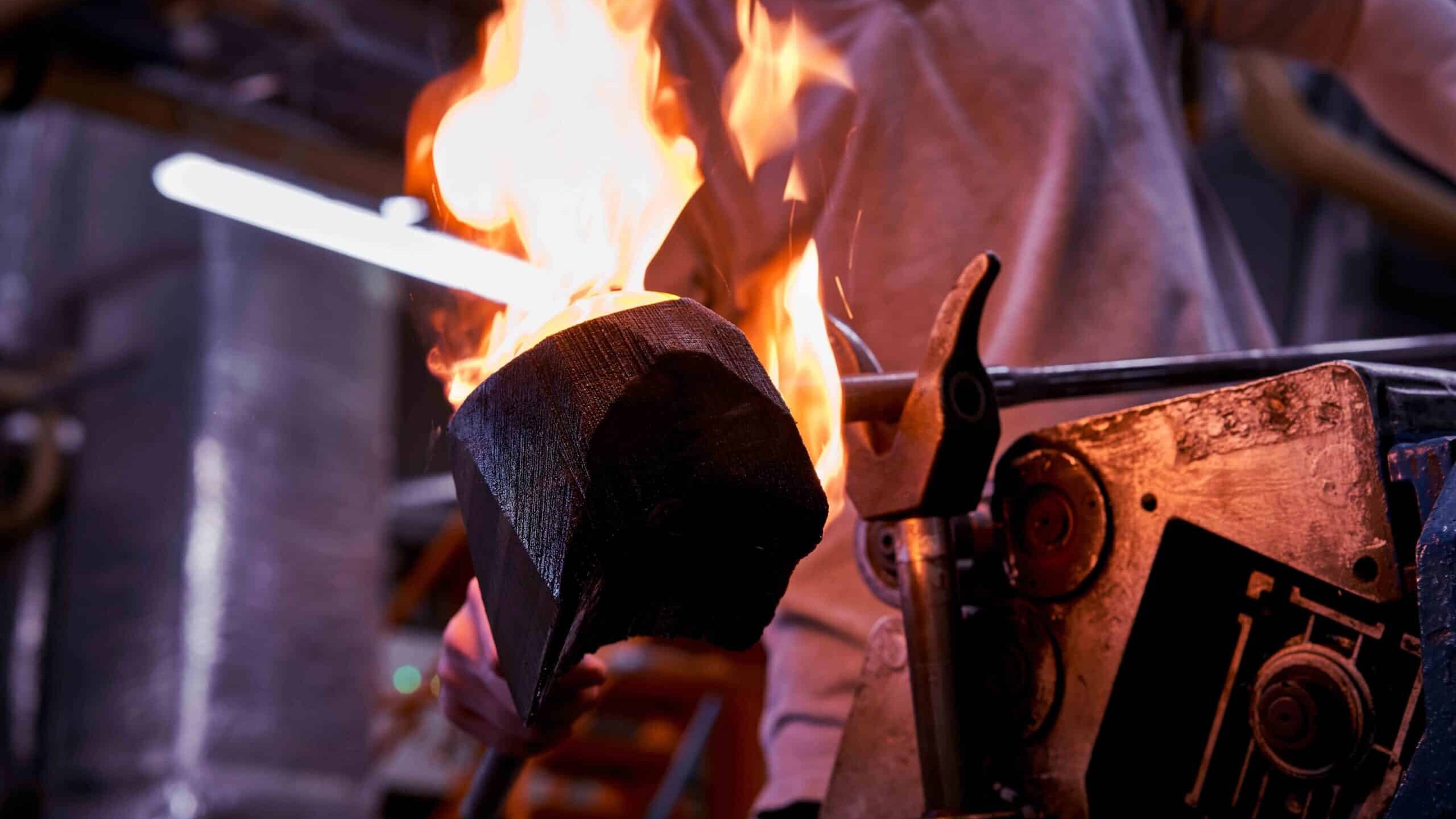 A professional blowing crystal glass at the Waterford Crystal factory