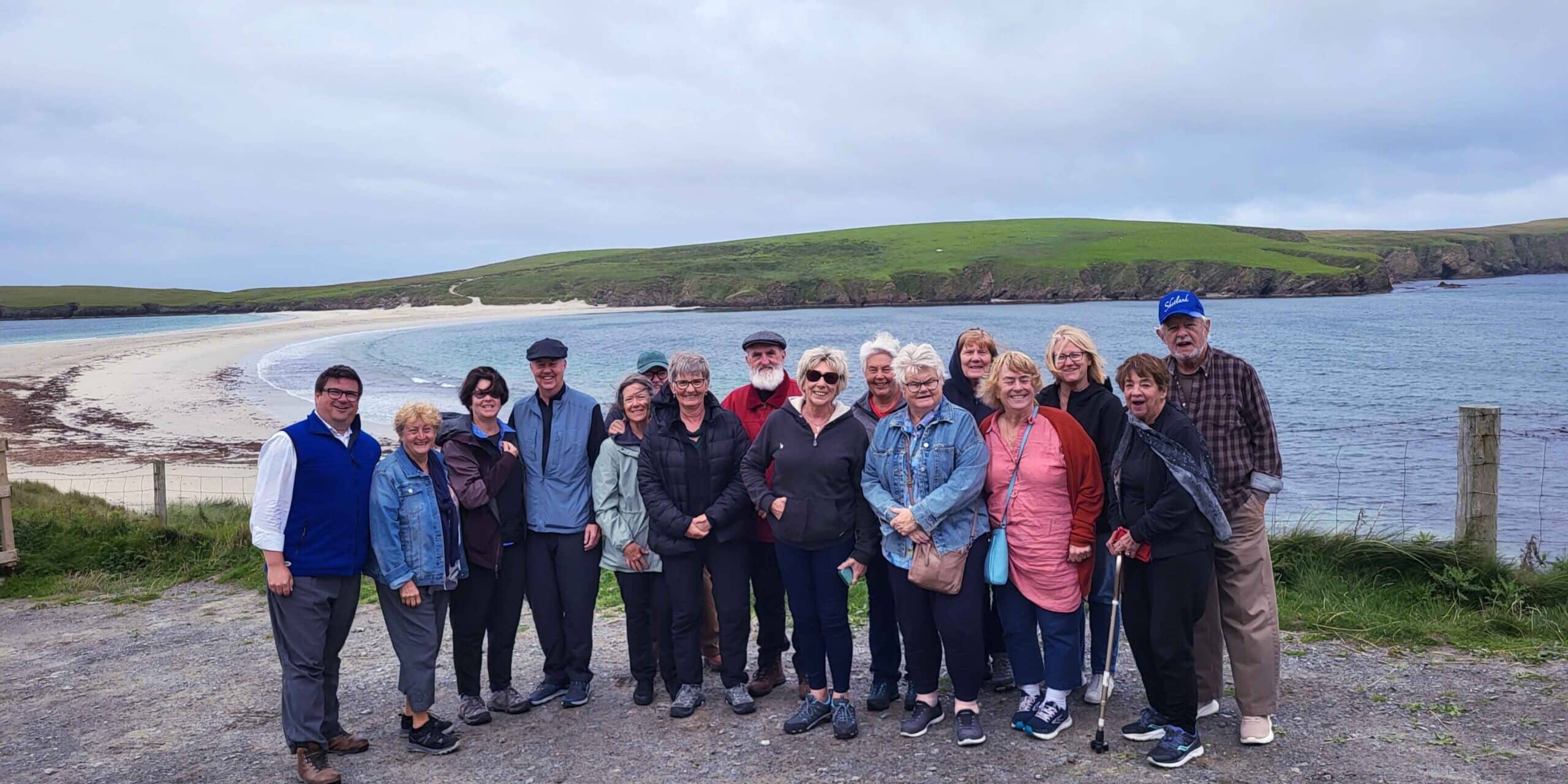 A McKinlay Kidd tour group at St Ninian's beach in Shetland