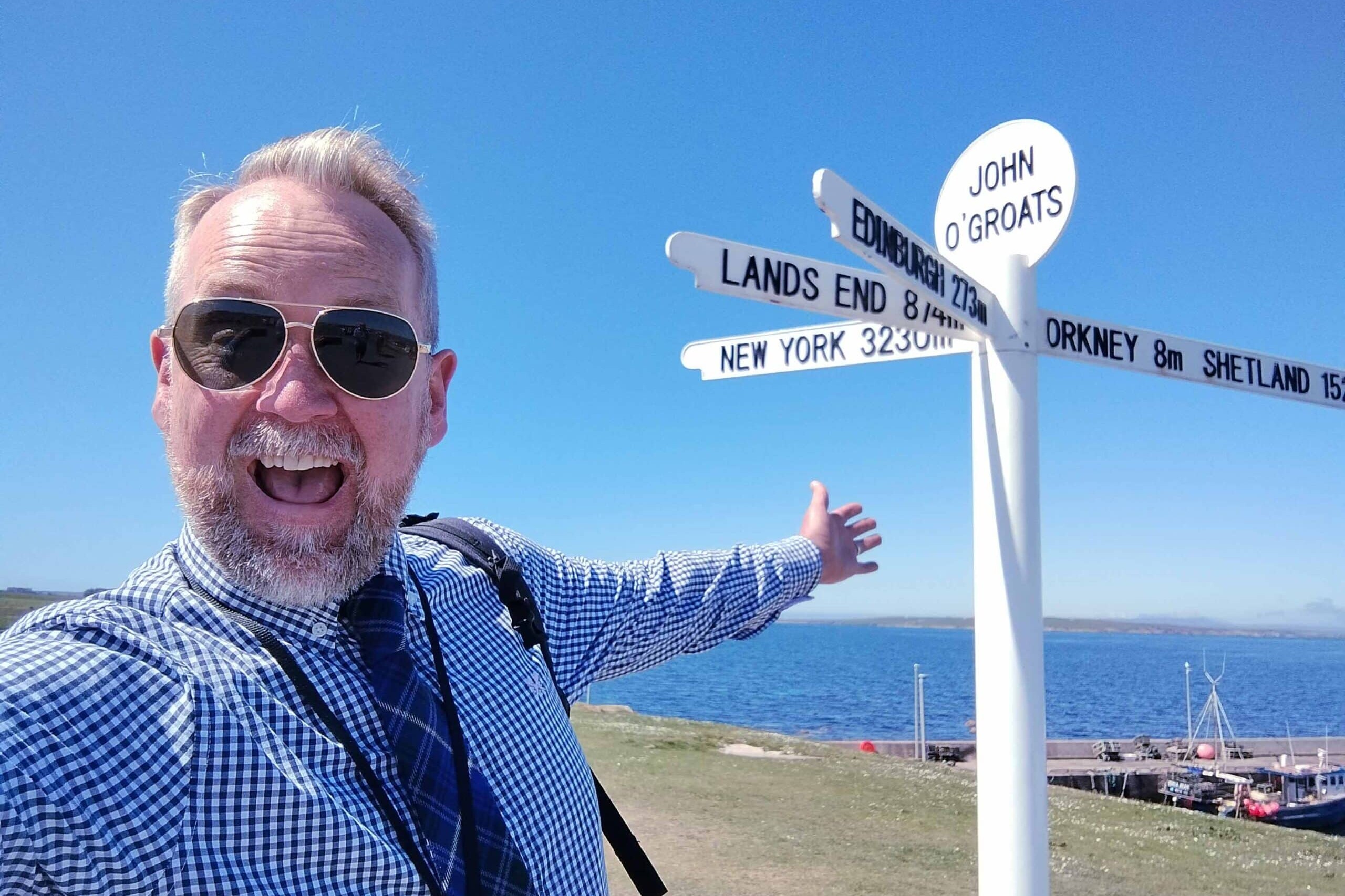 McKinlay Kidd guide Andrew out on tour at John O'Groats, Scotland