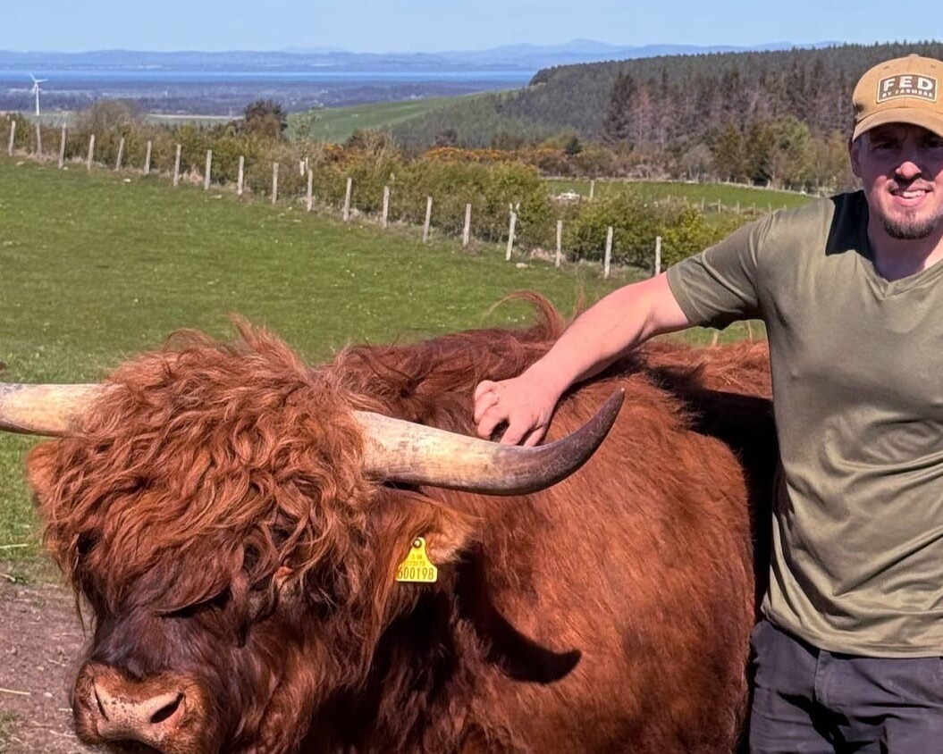 A farmer with a buffalo on a farm in Forres, Moray