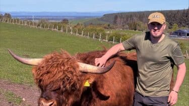 A farmer with a buffalo on a farm in Forres, Moray